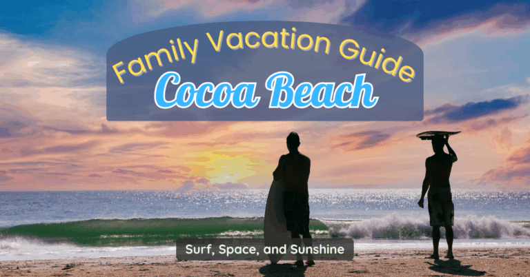 Two surfers silhouetted against a colorful sunrise on Cocoa Beach with waves breaking on the shore.